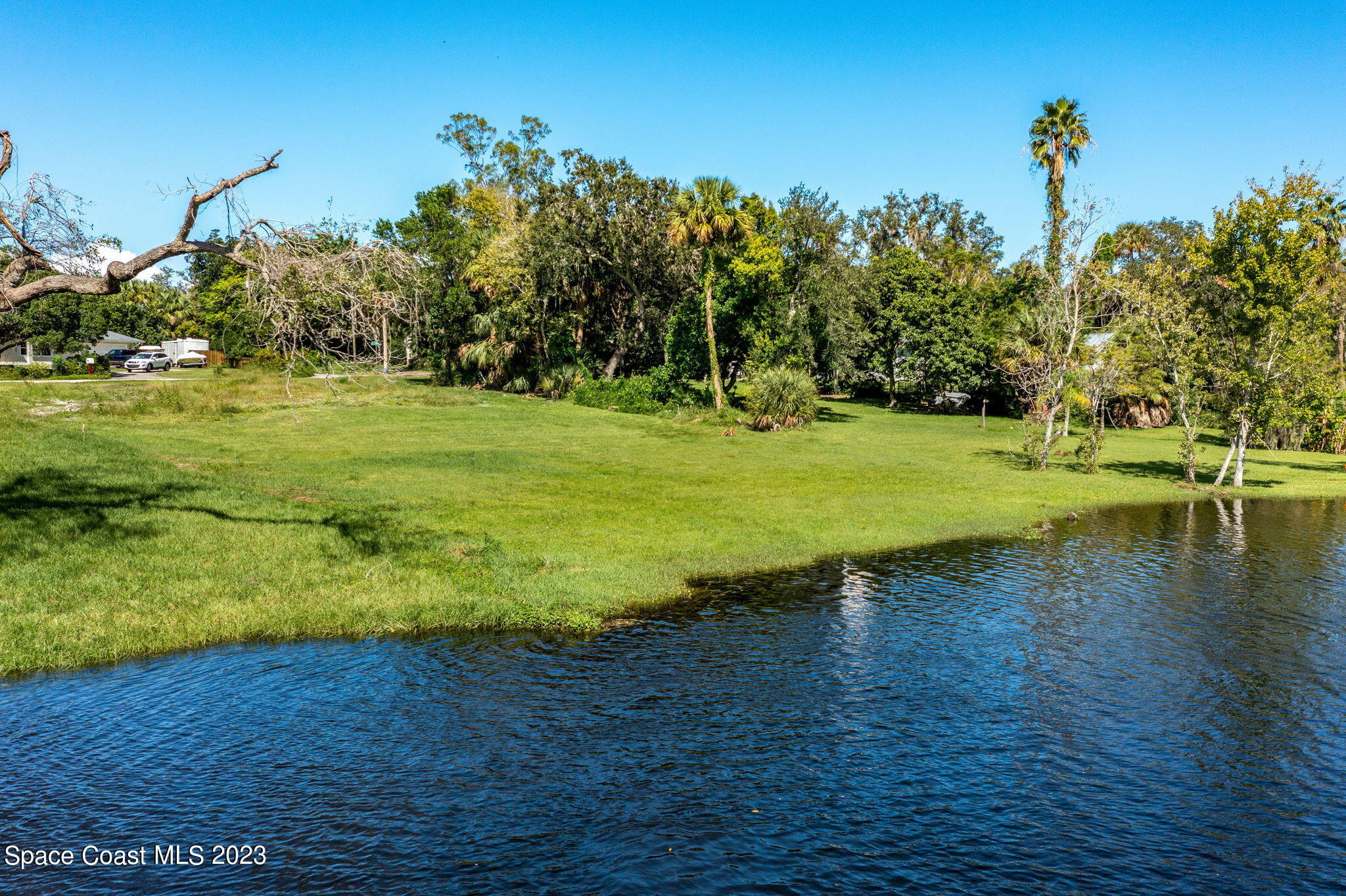 409 Roxy Avenue Melbourne, FL 32901 - Photo 3 of 31 a view of a golf course with a lake view