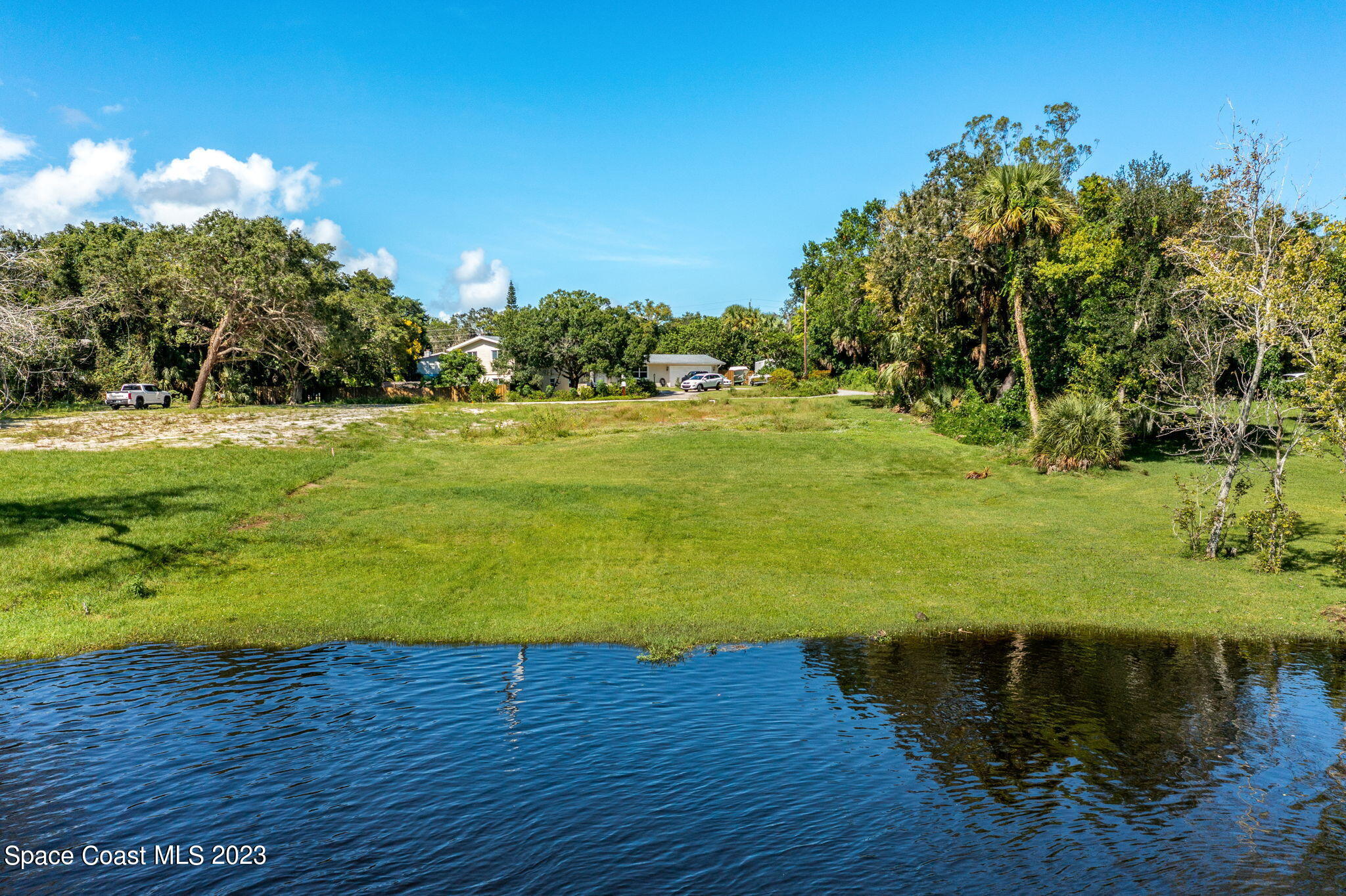 409 Roxy Avenue Melbourne, FL 32901 - Photo 10 of 31 a view of a lake with a big yard