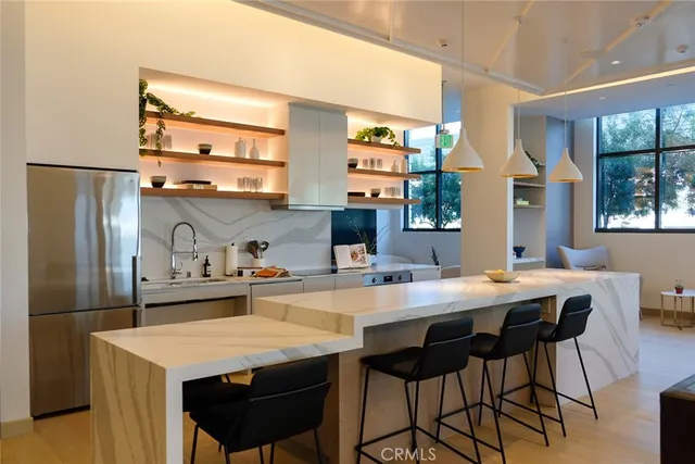 a kitchen with a table and chairs in it