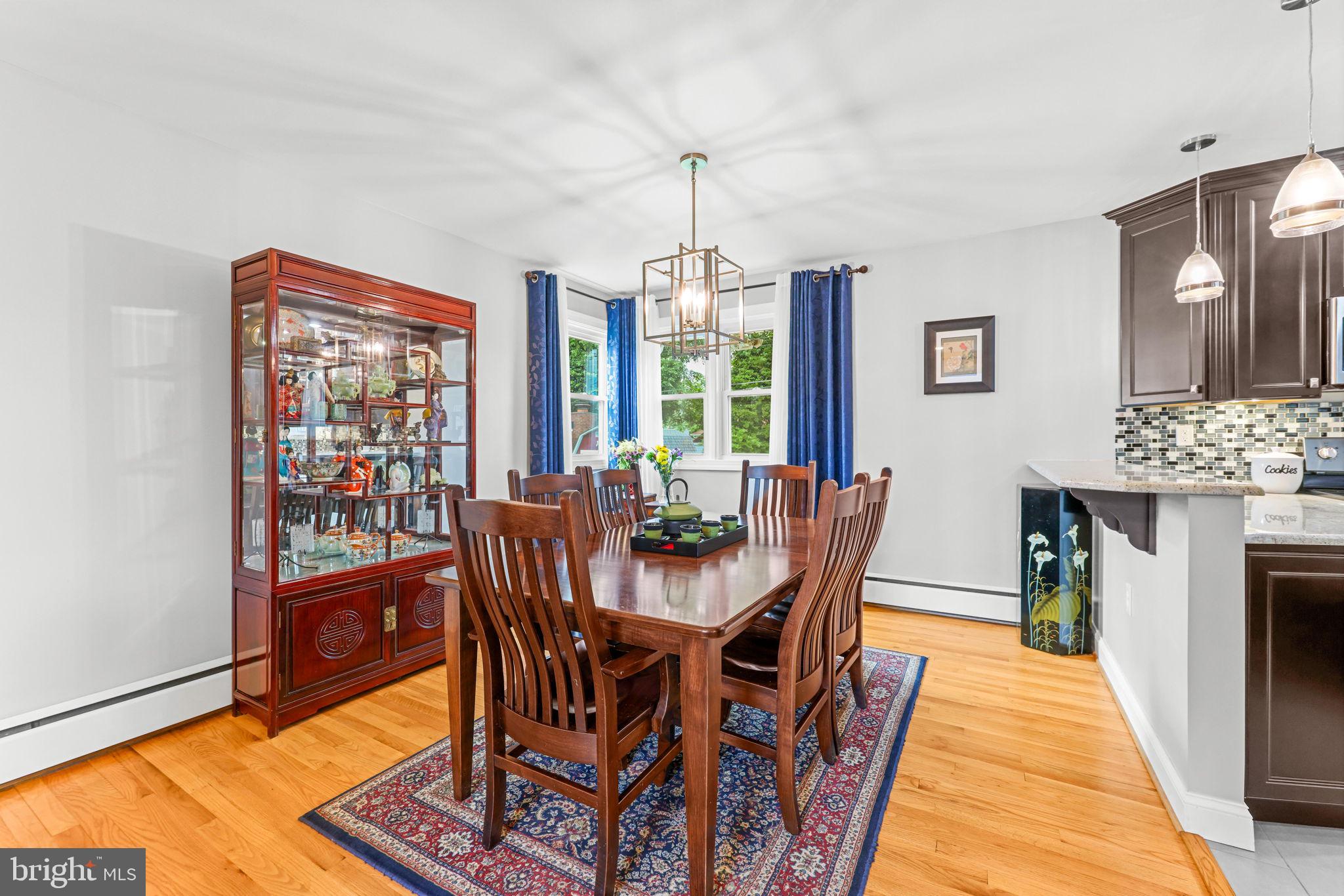 2902 Ritchie Avenue Baltimore, MD 21219 - Photo 18 of 43 a dining room with furniture window wooden floor