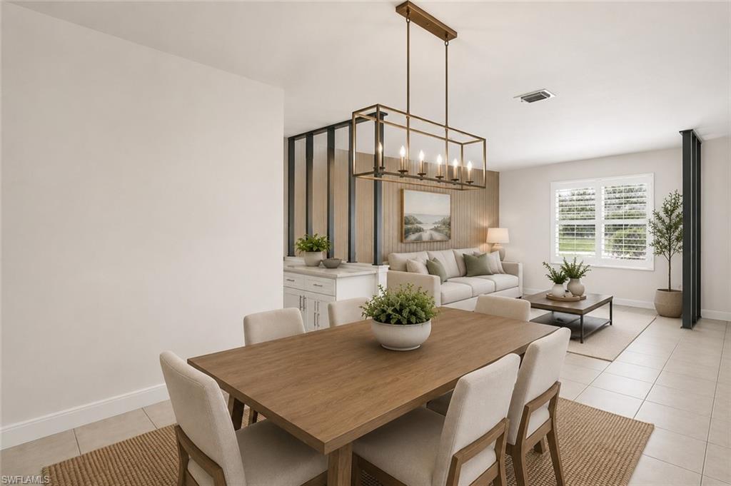 5290 Cypress Lane Naples, FL 34113 - Photo 15 of 39 a view of a dining room with furniture window and outside view