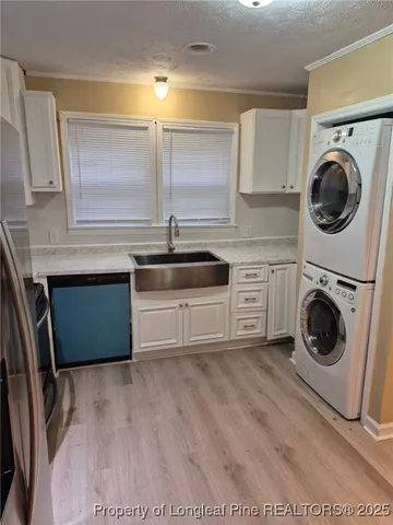 a kitchen with a stove top oven sink and cabinets
