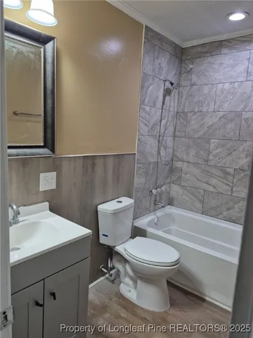 a bathroom with a toilet a sink and a bathtub