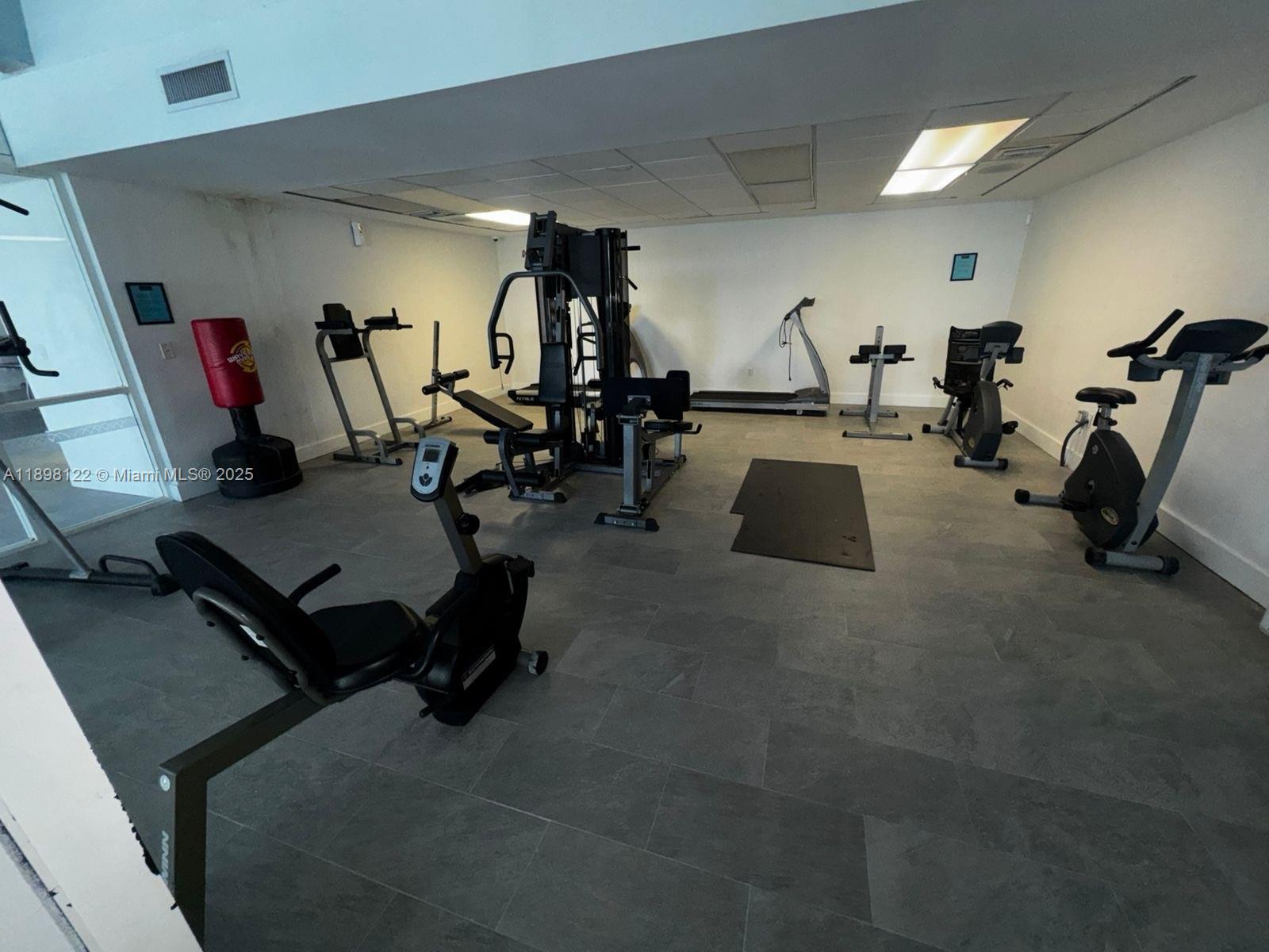 492 Northwest 165th Street, Unit C512 Miami, FL 33169 - Photo 22 of 27 a view of a room with gym equipment