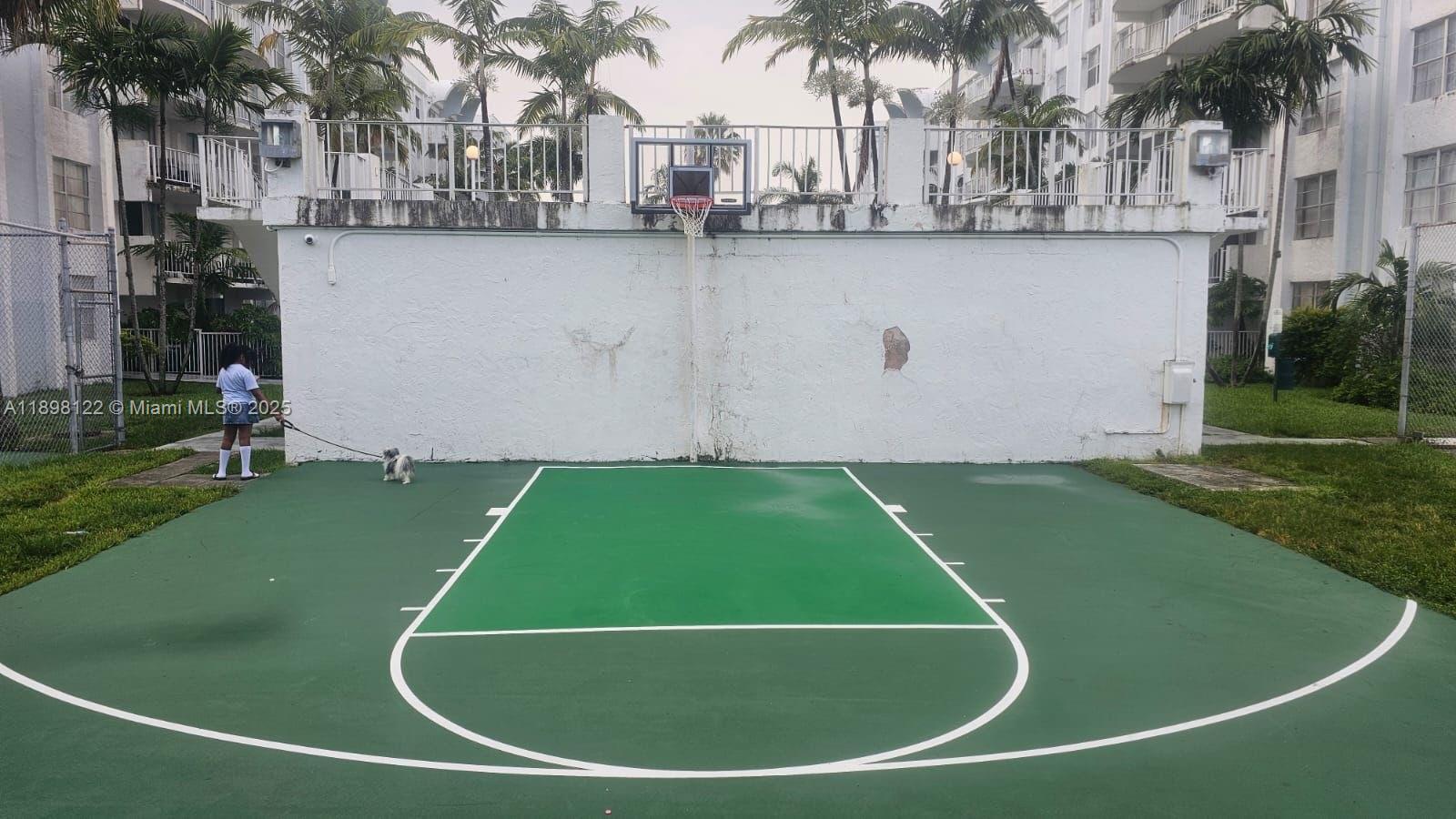 492 Northwest 165th Street, Unit C512 Miami, FL 33169 - Photo 24 of 27 a view of a swimming pool and a yard