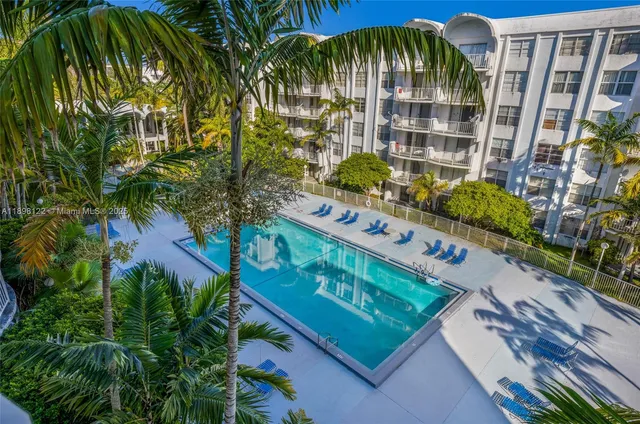 a front view of building with garden