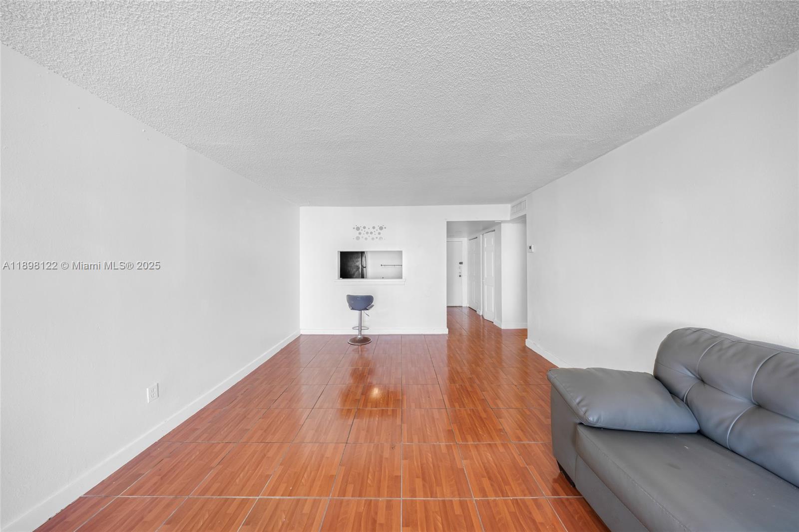 492 Northwest 165th Street, Unit C512 Miami, FL 33169 - Photo 7 of 27 a view of livingroom with furniture and wooden floor