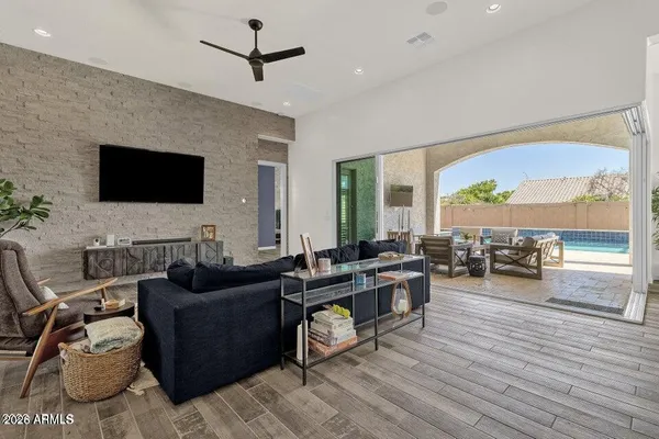 a living room with fireplace furniture and a flat screen tv