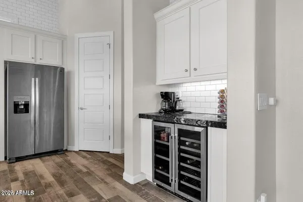 a kitchen with stainless steel appliances granite countertop a stove and a refrigerator
