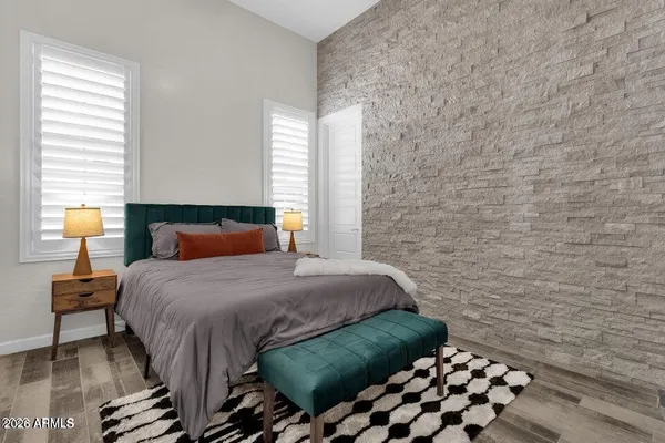 a bedroom with a bed and a window
