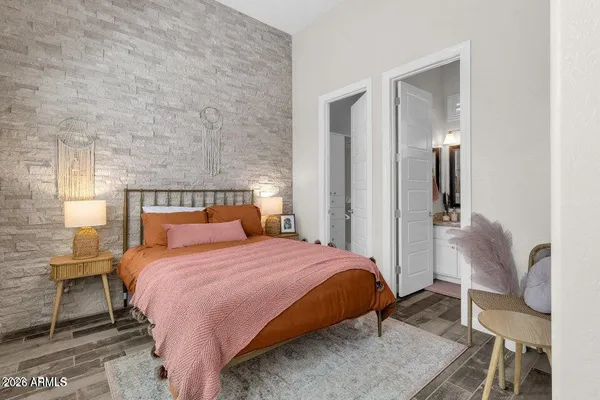 a bedroom with a bed and a table in it