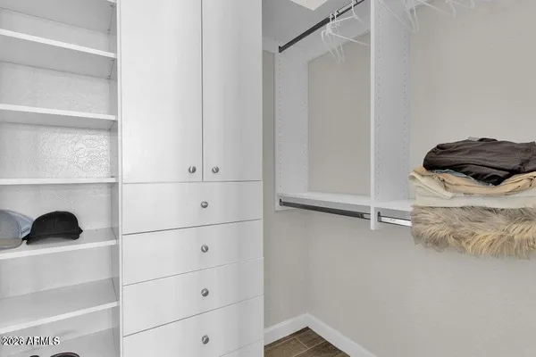 a bathroom with a closet and a window