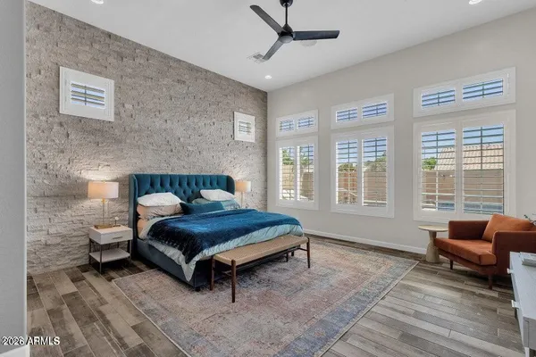 a bedroom with a bed and a couch