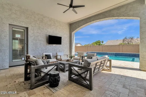 a living room with furniture and a flat screen tv