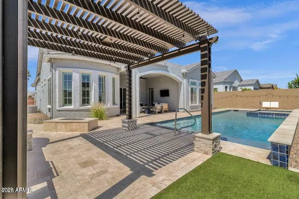 a view of an house with backyard porch and furniture