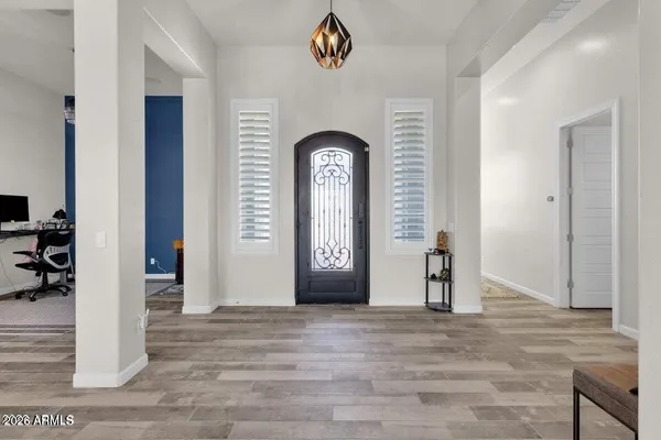 an empty room with closet and mirror