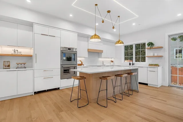 a view of a bathroom with a sink and mirror