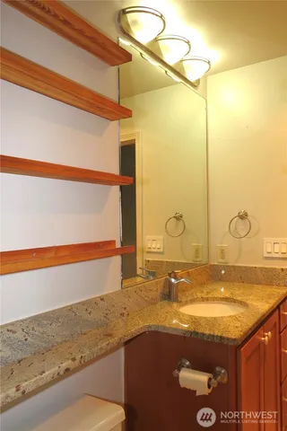 a view of a hallway with a wooden door