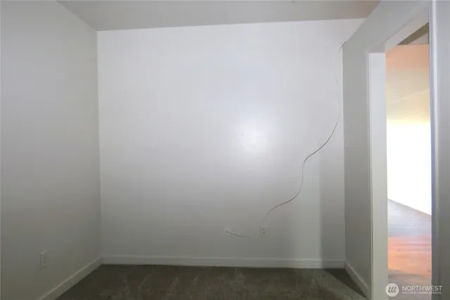 a backyard of a house with barbeque oven table and chairs