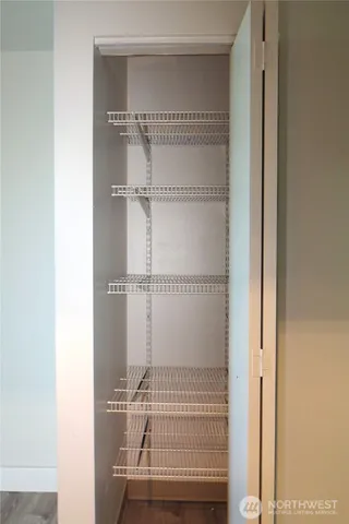 a bathroom with a granite countertop bathtub shower sink vanity and toilet