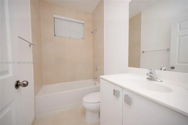 a room that has a bench and a table in it