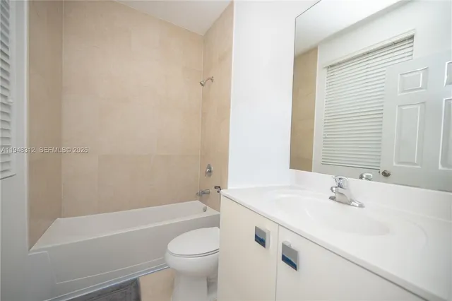 a living room with a bed furniture and a window