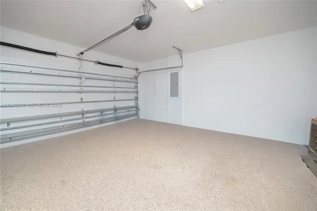 a view of a house with swimming pool and sitting area