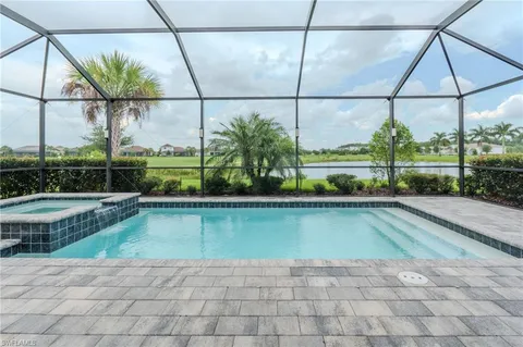 a view of swimming pool with a patio