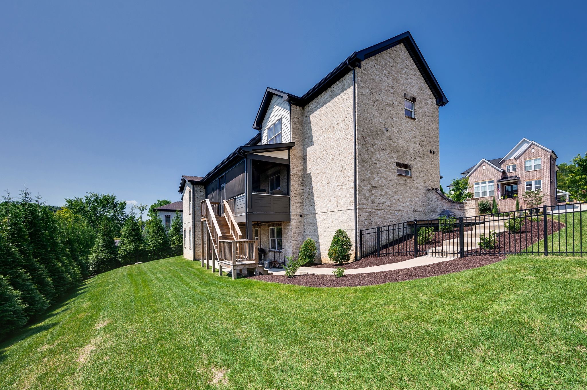 2156 Hartland Road Franklin, TN 37069 - Photo 60 of 63 a view of house with a yard and table and chair in patio