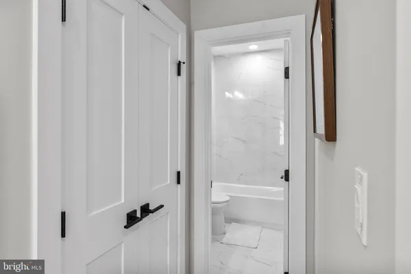 a bathroom with a glass shower door