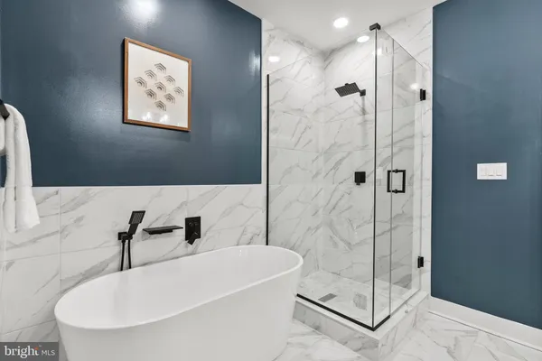 a bathroom with a shower and a sink