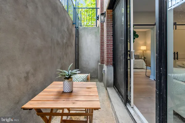 a dining room with furniture and wooden floor