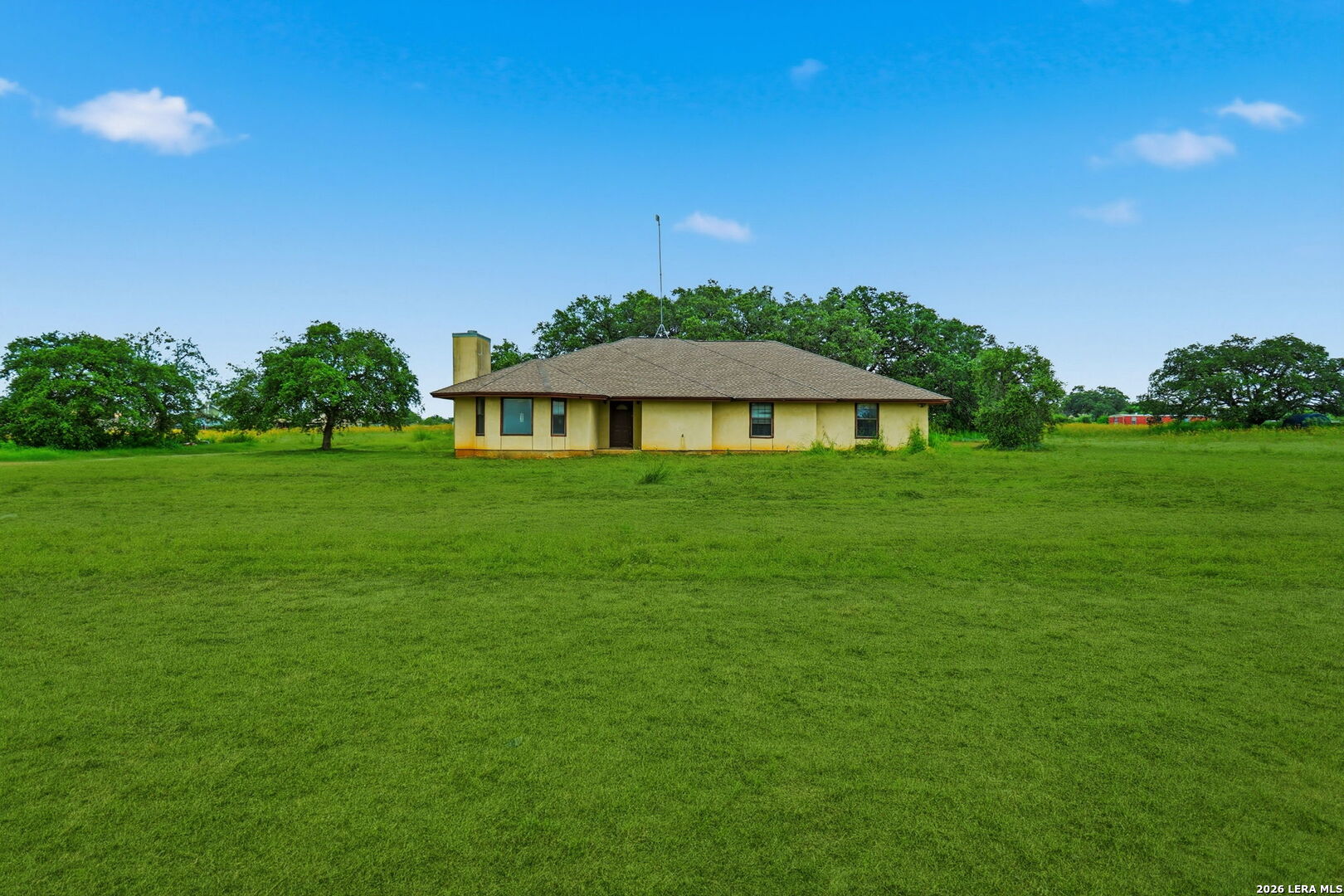 3061 Horse Ranch Road San Antonio, TX 78264 - Photo 25 of 34 a view of a house with a yard