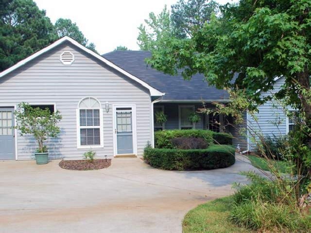 41 Tanglewood Road Newnan, GA 30263 - Photo 1 of 1 a front view of a house with a yard and potted plants