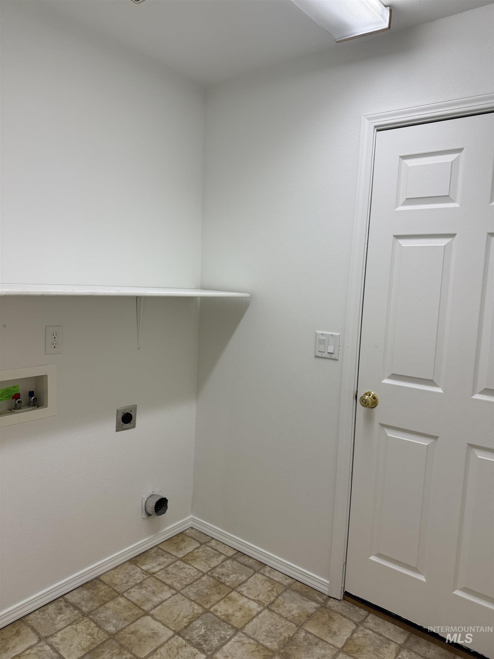 523 Morning Dove Way Marsing, ID 83639 - Photo 22 of 23 Laundry room featuring stone finish flooring, washer hookup, and hookup for an electric dryer
