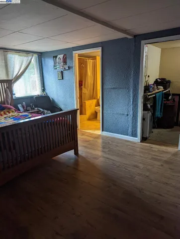 a kitchen with stainless steel appliances a stove a sink and a refrigerator