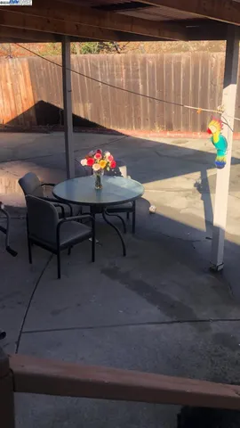 a view of a backyard with a patio