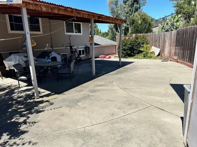 a living room with furniture a air conditioner and a table