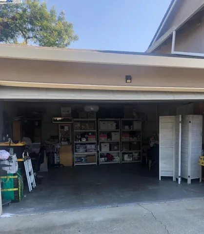 a kitchen with granite countertop a sink cabinets and window