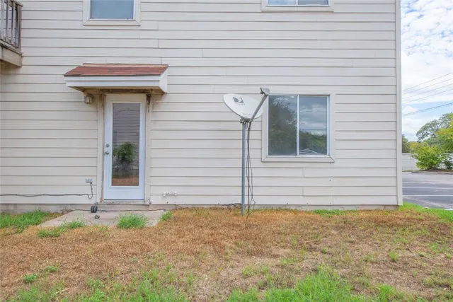 a view of a house with small yard