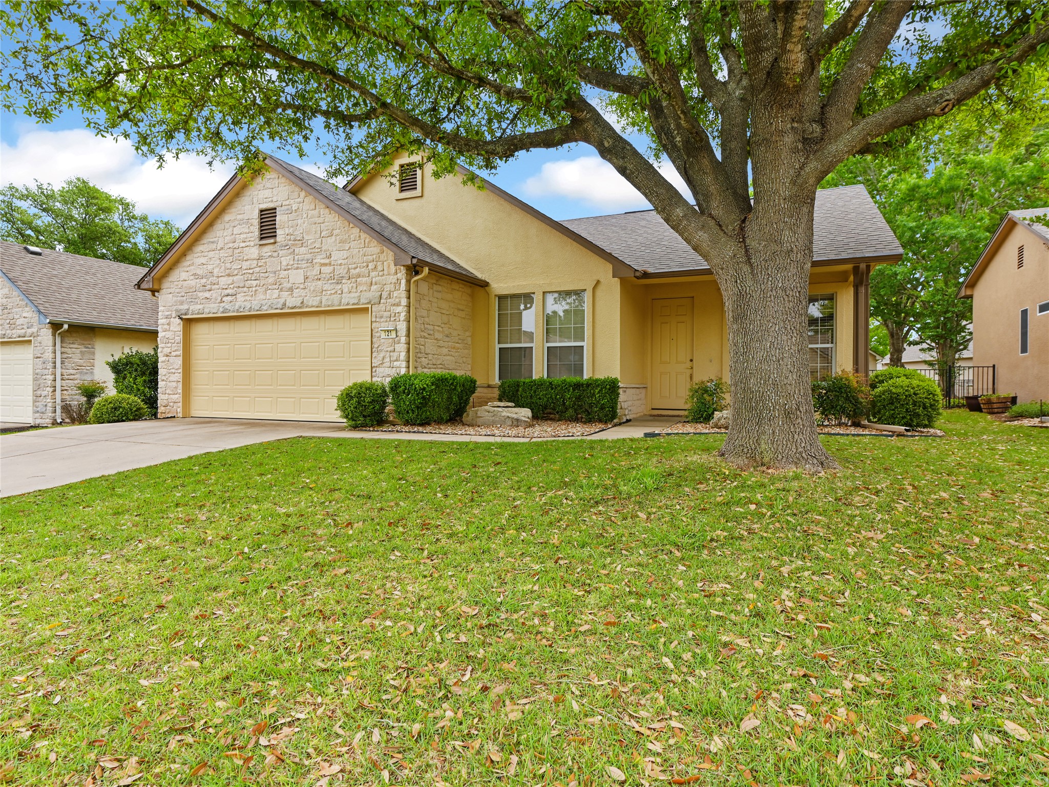 a front view of house with yard and green space