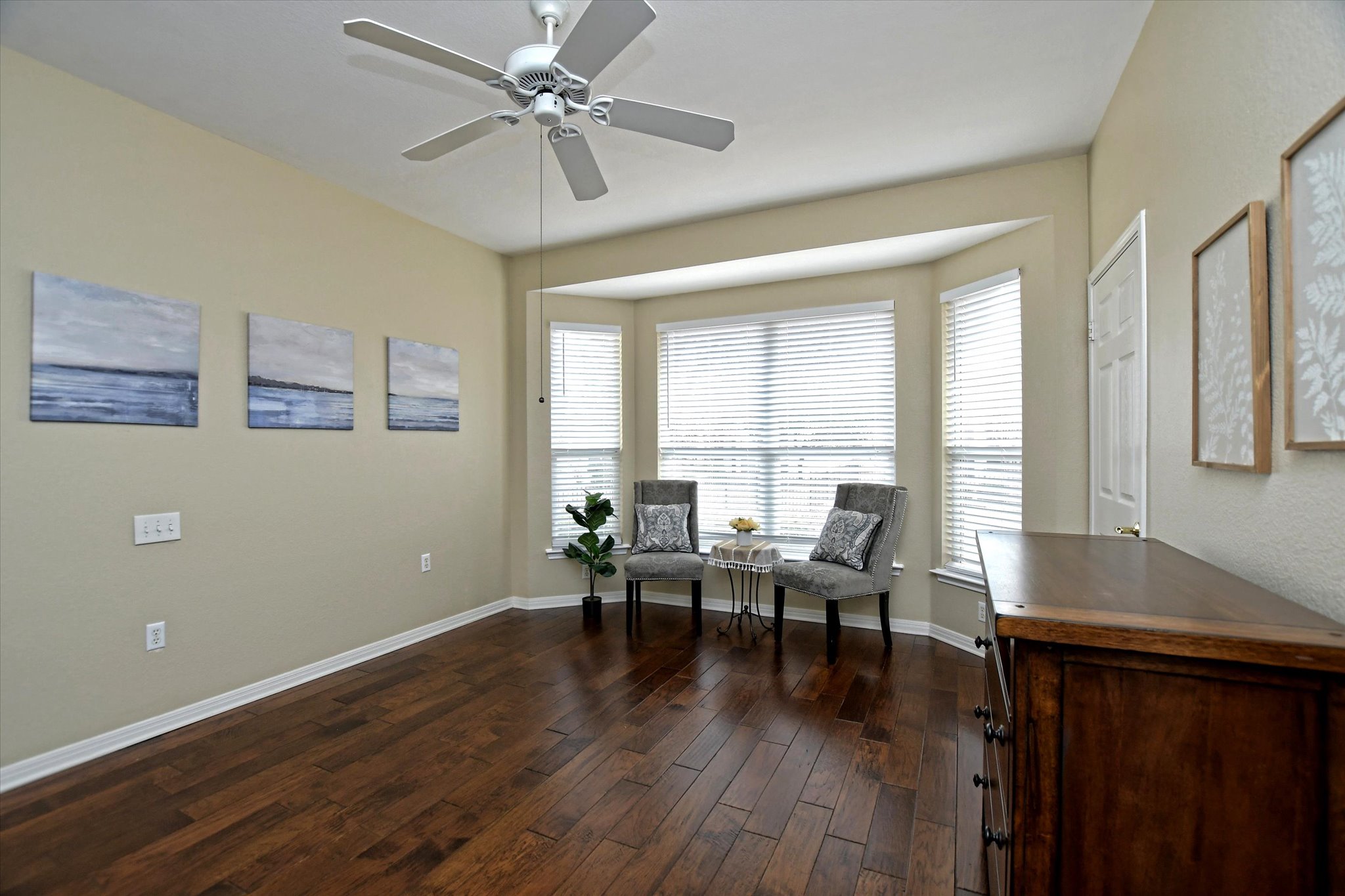121 Buttercup Trail Georgetown, TX 78633 - Photo 13 of 31 Primary bedroom with bay window and ceiling fan.