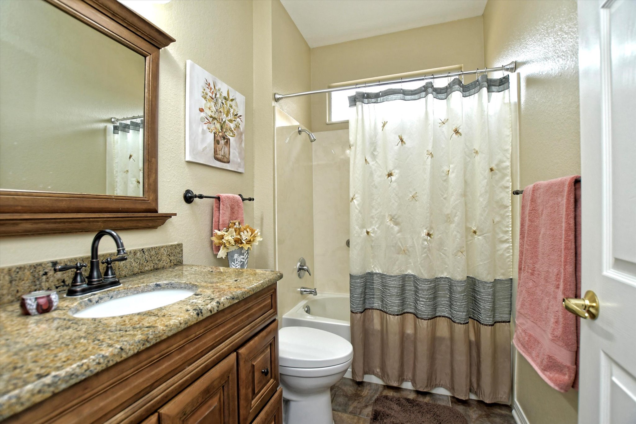 121 Buttercup Trail Georgetown, TX 78633 - Photo 18 of 31 Guest bathroom with updated granite wooden sink cabinet and mirror.