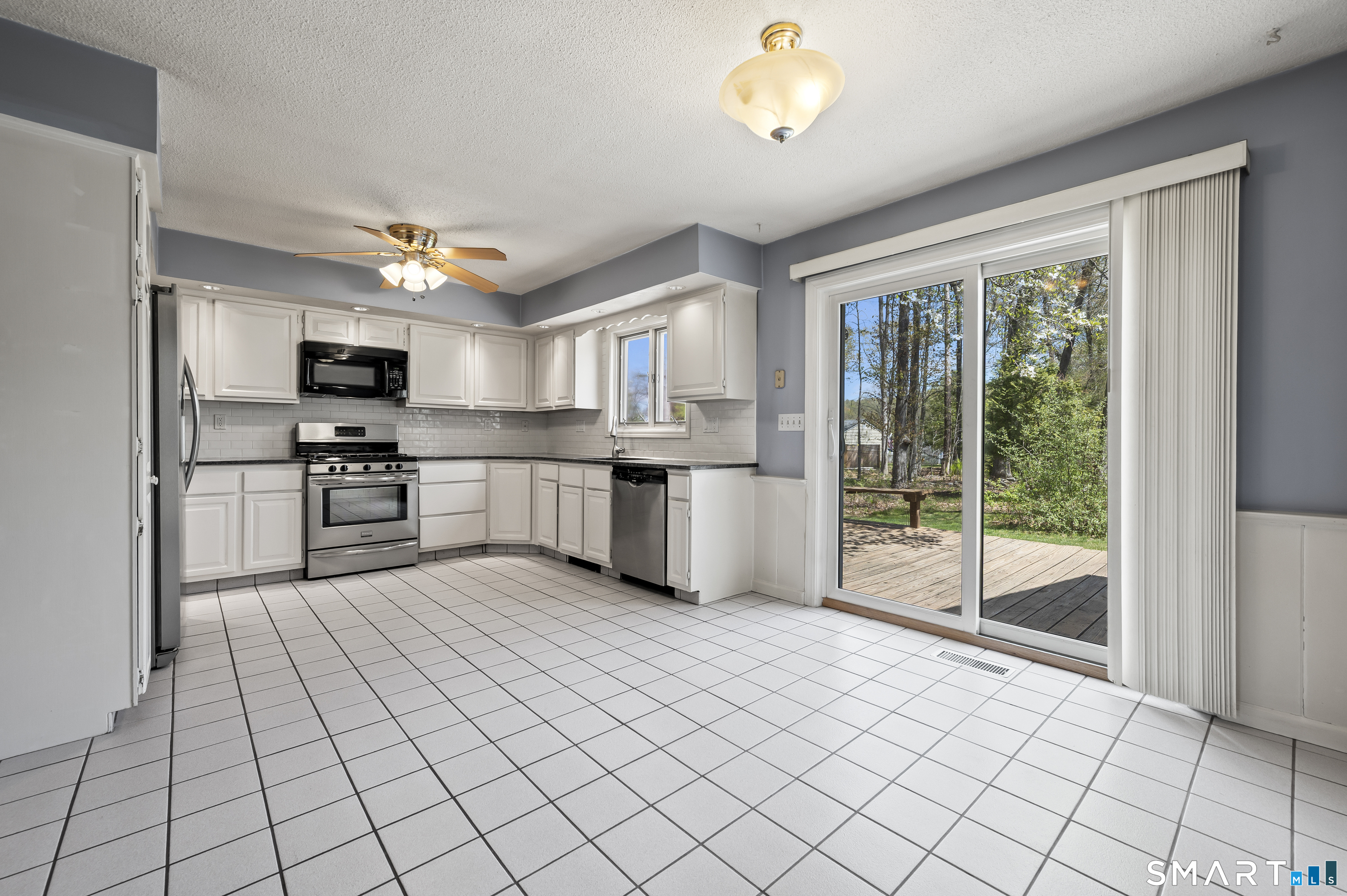 117 Charter Oak Road Southbury, CT 06488 - Photo 11 of 40 a large kitchen with cabinets and steel stainless steel appliances