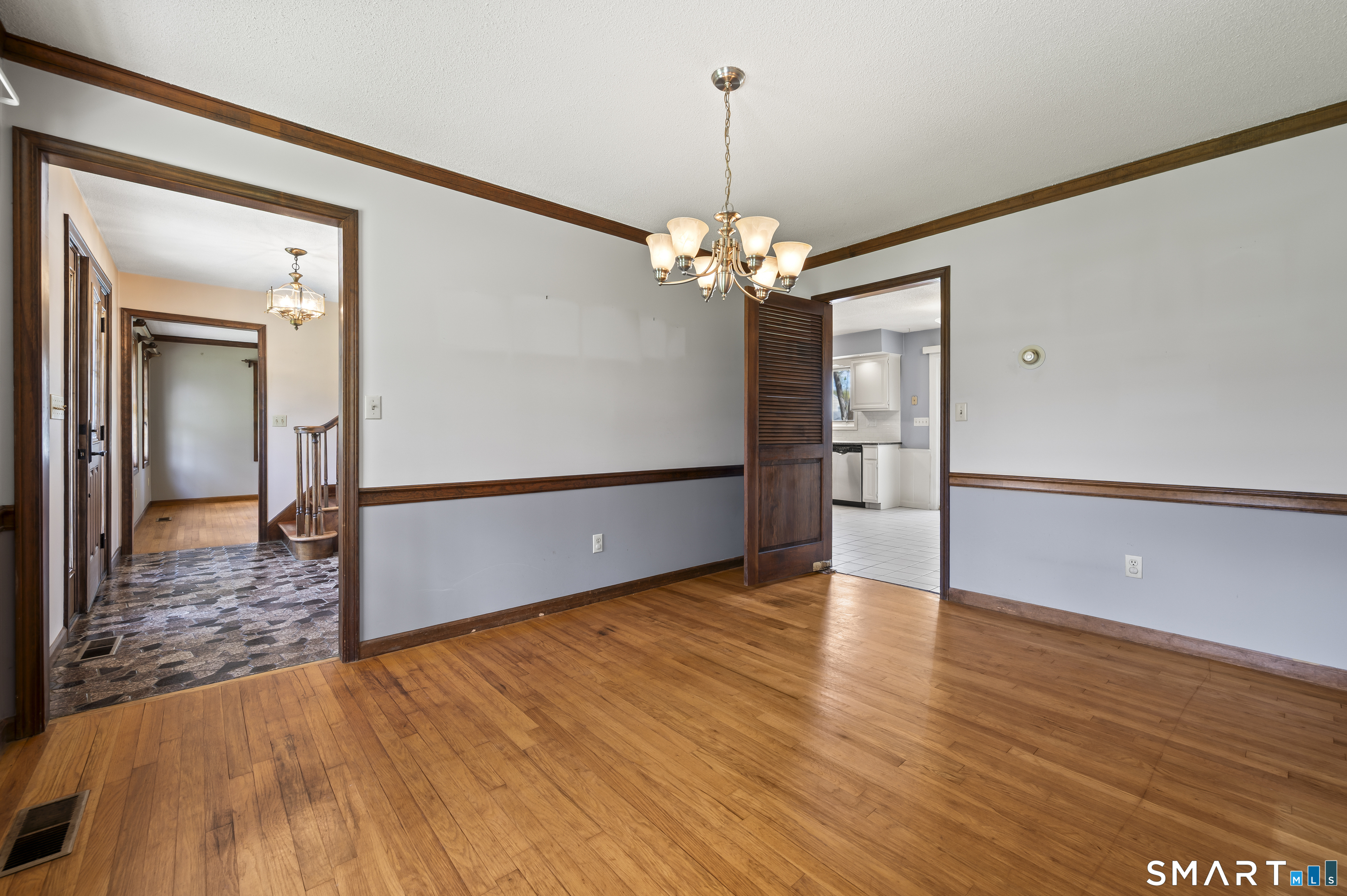 117 Charter Oak Road Southbury, CT 06488 - Photo 15 of 40 a view of a livingroom with a furniture wooden floor and chandelier