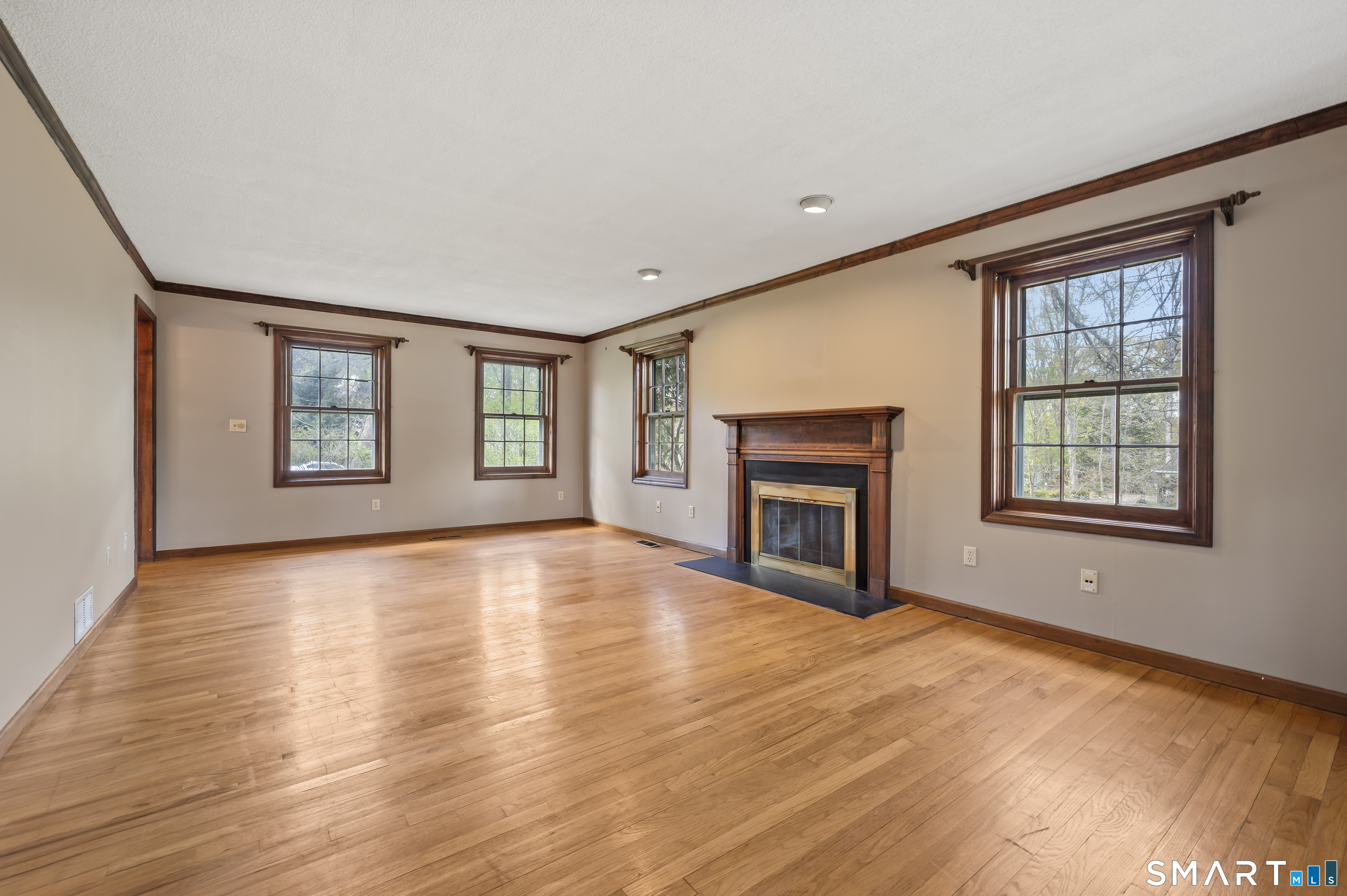 117 Charter Oak Road Southbury, CT 06488 - Photo 19 of 40 a view of an empty room with a window and fireplace