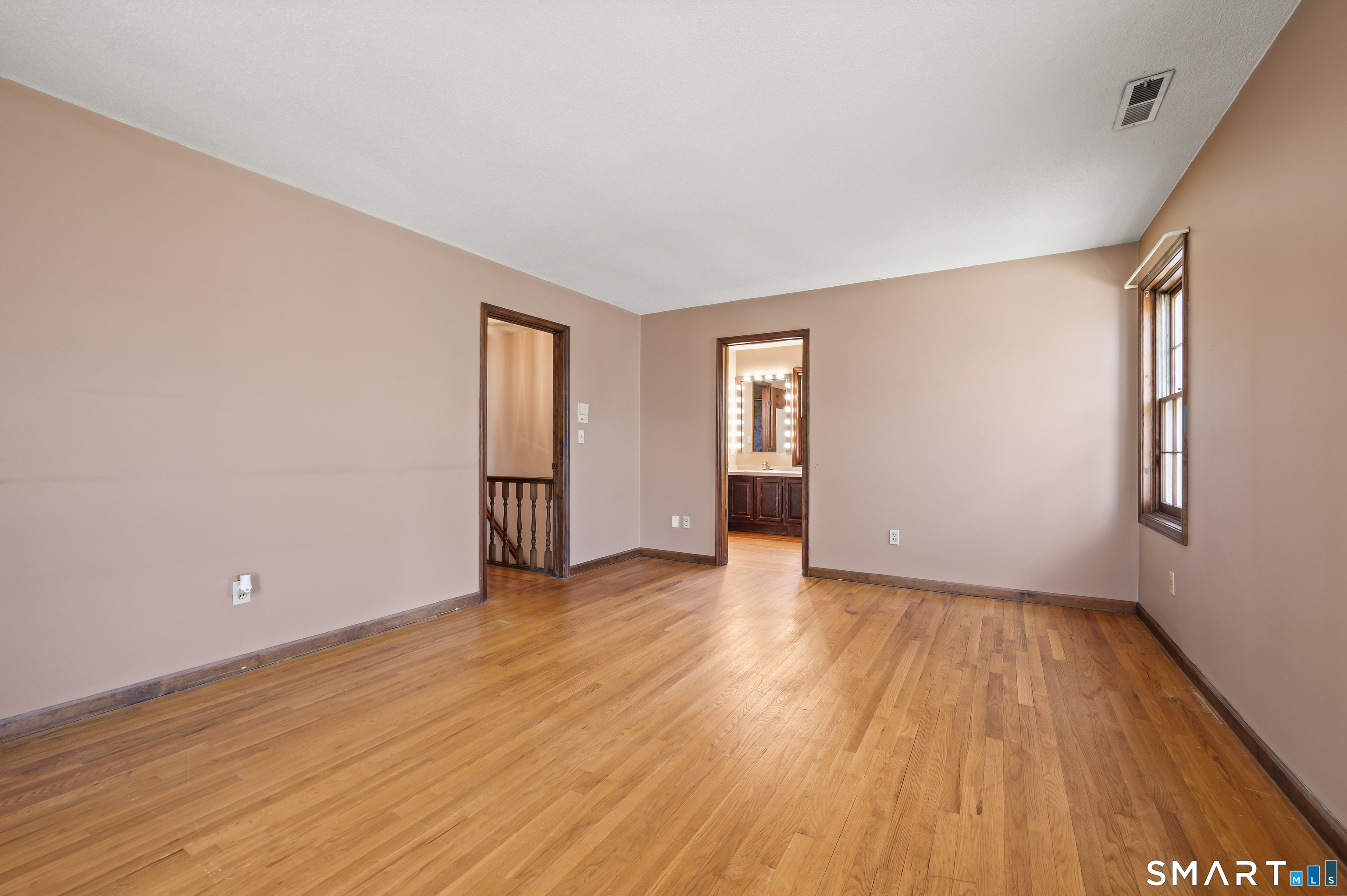 117 Charter Oak Road Southbury, CT 06488 - Photo 24 of 40 a view of an empty room with wooden floor and closet