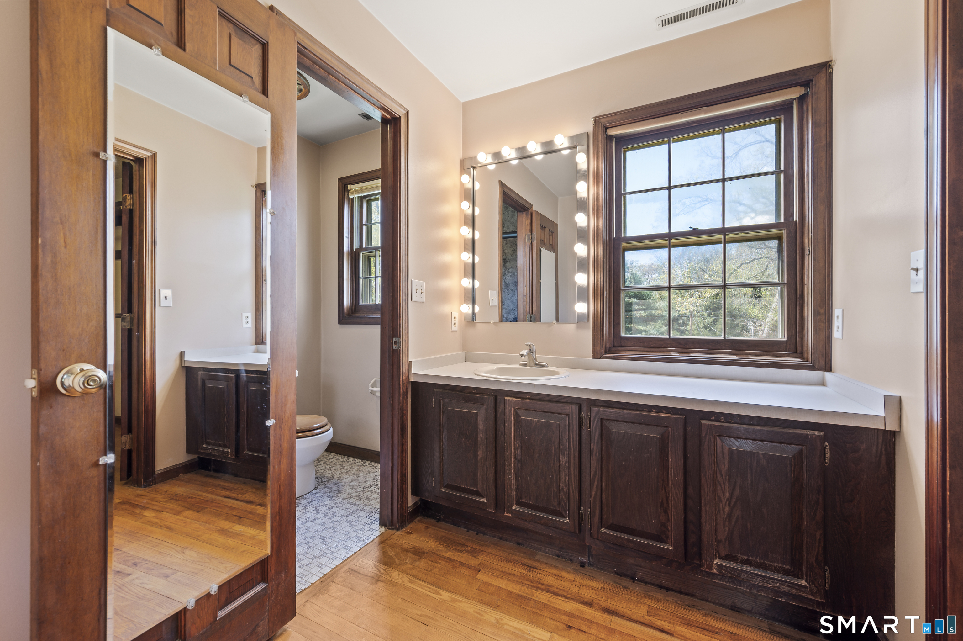 117 Charter Oak Road Southbury, CT 06488 - Photo 25 of 40 a spacious bathroom with a sink and a large mirror