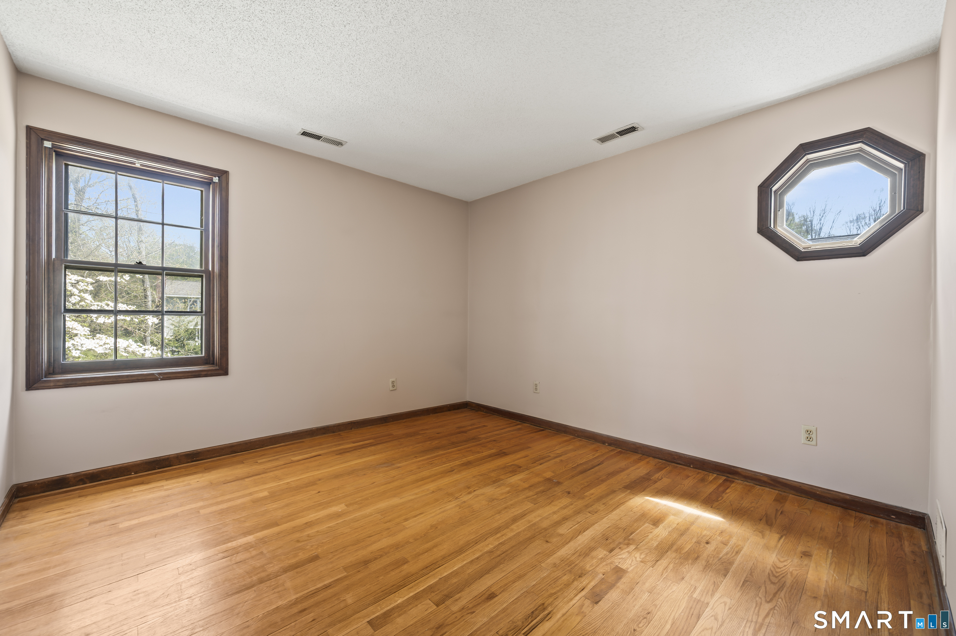 117 Charter Oak Road Southbury, CT 06488 - Photo 29 of 40 an empty room with a window and mirror