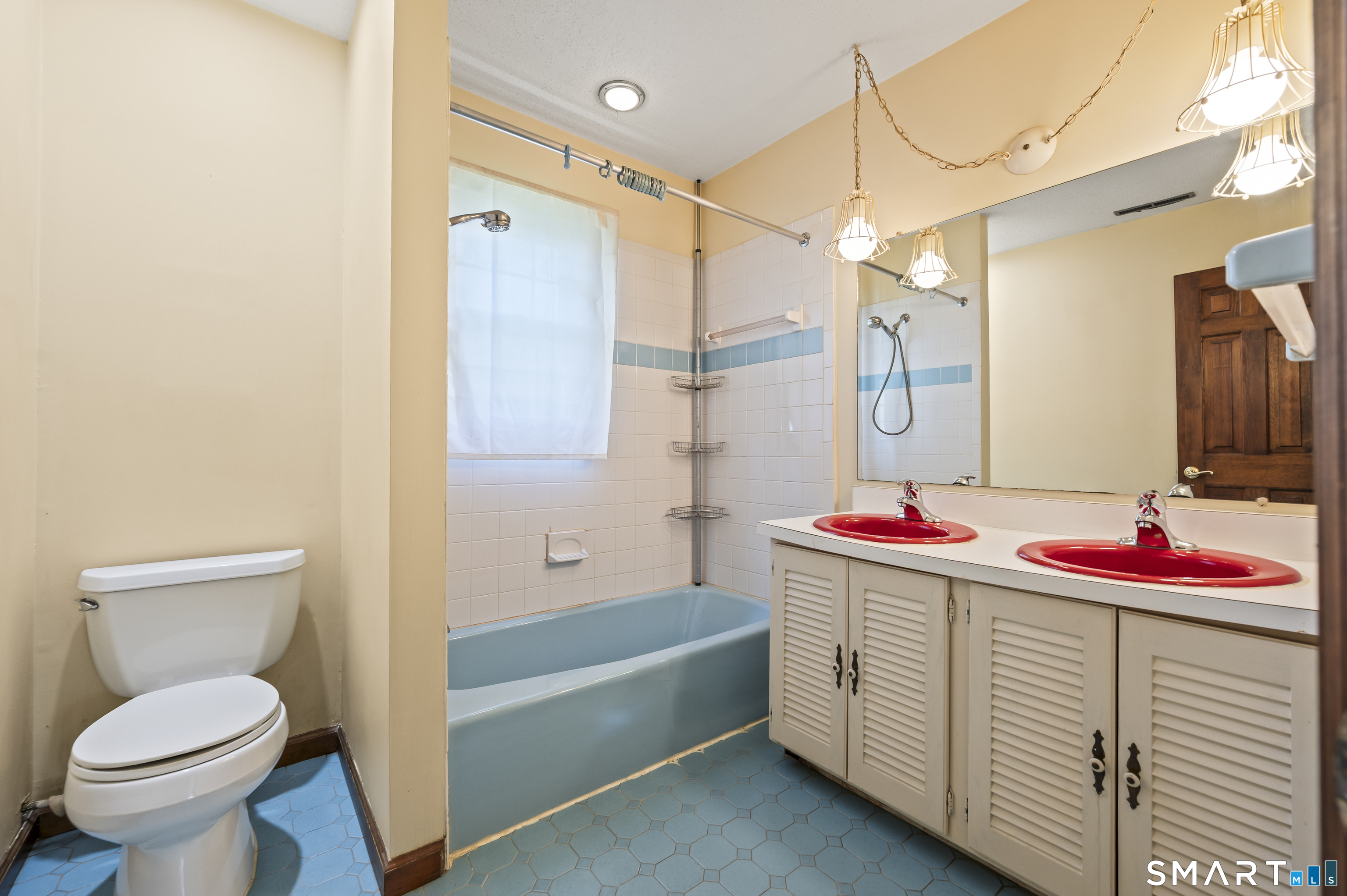 117 Charter Oak Road Southbury, CT 06488 - Photo 31 of 40 a bathroom with a sink vanity mirror and toilet